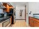Hallway with hardwood flooring and wooden cabinets, leading to other parts of the home at 601 W 11Th Ave # 109, Denver, CO 80204