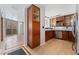 Open kitchen area with wooden cabinets, stainless steel appliances and open concept living area at 601 W 11Th Ave # 109, Denver, CO 80204