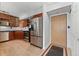 Kitchen featuring stainless steel appliances, wooden cabinets, and a convenient layout at 601 W 11Th Ave # 109, Denver, CO 80204