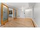 Spacious living room with hardwood floors and a sliding door, perfect for entertaining at 601 W 11Th Ave # 109, Denver, CO 80204