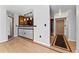 Open living space with wood floors, stylish bar area, and easy access to the entrance at 601 W 11Th Ave # 109, Denver, CO 80204