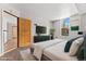 Spacious main bedroom with large window and virtually staged furniture at 601 W 11Th Ave # 109, Denver, CO 80204