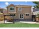 Exterior view of the backyard featuring lush grass, patio area, and a wooden pergola at 4763 Laurelglen Ln, Highlands Ranch, CO 80130