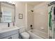 Bathroom with tub, shower, sink, framed mirror, and neutral decor at 4763 Laurelglen Ln, Highlands Ranch, CO 80130