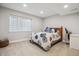 Cozy carpeted bedroom with window, comfortable bed, and neutral walls at 4763 Laurelglen Ln, Highlands Ranch, CO 80130