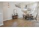 Spacious dining area with wood floors, a modern chandelier, and staircase, perfect for gatherings at 4763 Laurelglen Ln, Highlands Ranch, CO 80130
