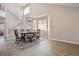 Bright dining room featuring wood floors, large windows, modern chandelier, and a staircase at 4763 Laurelglen Ln, Highlands Ranch, CO 80130