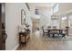 Inviting entryway with wood floors, high ceilings, staircase and adjacent dining area with modern chandelier at 4763 Laurelglen Ln, Highlands Ranch, CO 80130