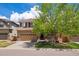 Charming two-story home with a two car garage, attractive landscaping, and inviting front porch at 4763 Laurelglen Ln, Highlands Ranch, CO 80130