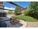 Back patio with furniture and pergola, perfect for outdoor dining and entertaining at 4763 Laurelglen Ln, Highlands Ranch, CO 80130