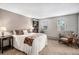 Bright bedroom with neutral walls, carpet floors, and built-in shelving at 5115 E Davies Dr, Centennial, CO 80122