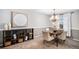 Neutral dining room with a wooden table, upholstered chairs, and stylish decor at 5115 E Davies Dr, Centennial, CO 80122