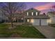 Charming two-story home with a well-manicured lawn and a cozy front porch at 5115 E Davies Dr, Centennial, CO 80122