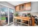 Bright kitchen with sliding glass doors to the deck and bar seating at 5115 E Davies Dr, Centennial, CO 80122