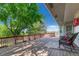 Relaxing back deck with comfortable seating and a scenic view of lush greenery at 1572 W Long Ave, Littleton, CO 80120