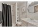Cozy bathroom featuring a glass shower, white fixtures, and decorative accents at 1572 W Long Ave, Littleton, CO 80120
