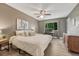Relaxing bedroom featuring wood-look floors, a ceiling fan, and a spacious workstation at 1572 W Long Ave, Littleton, CO 80120