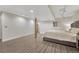 Well-lit bedroom showcasing stylish flooring, a comfortable bed, and neutral decor at 1572 W Long Ave, Littleton, CO 80120
