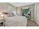 Cozy bedroom features neutral tones, ample natural light, and a dedicated desk area at 1572 W Long Ave, Littleton, CO 80120