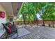 Relaxing deck with outdoor seating surrounded by mature trees at 1572 W Long Ave, Littleton, CO 80120