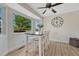 Inviting breakfast nook offers natural light and stylish furnishings at 1572 W Long Ave, Littleton, CO 80120