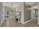 Stylish foyer with shiplap walls, modern console table, and wood-look flooring at 1572 W Long Ave, Littleton, CO 80120