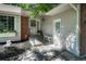 Welcoming front porch with a seating area and decorative accents by the entry at 1572 W Long Ave, Littleton, CO 80120