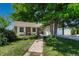 Beautiful home featuring lush landscaping and a welcoming front entrance at 1572 W Long Ave, Littleton, CO 80120