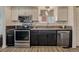 Well-appointed kitchen features sleek appliances and ample counter space at 1572 W Long Ave, Littleton, CO 80120