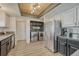 Convenient laundry area located off the kitchen, featuring modern appliances at 1572 W Long Ave, Littleton, CO 80120