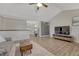 Open-concept living area featuring wood floors and stylish decor at 1572 W Long Ave, Littleton, CO 80120