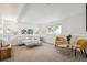 Cozy basement featuring neutral-toned furniture, bright lighting, and a comfortable atmosphere at 18355 W 59Th Dr, Golden, CO 80403