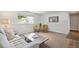 Cozy basement features a comfortable seating area and stylish decor, bathed in soft natural light at 18355 W 59Th Dr, Golden, CO 80403