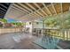Outdoor deck features a covered ceiling, railing, furniture, and a neighborhood view at 18355 W 59Th Dr, Golden, CO 80403