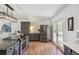 Well-lit kitchen with stainless steel refrigerator, central island, and adjacent dining area at 18355 W 59Th Dr, Golden, CO 80403