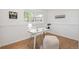 Bright home office with natural light, modern desk, comfy stool, and stylish wall art at 18355 W 59Th Dr, Golden, CO 80403