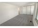 Spacious bedroom with plush carpeting and a view of the backyard at 3552 S Kittredge St # C, Aurora, CO 80013