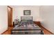 Cozy bedroom has wood floors and ample space for a bed and nightstands at 7750 W 87Th Dr # C, Arvada, CO 80005