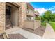 Exterior condo entrance with stone facade, private balconies, and well-kept landscaping at 7750 W 87Th Dr # C, Arvada, CO 80005