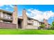 Attractive condo exterior with private balconies, stone accents, and well-maintained landscaping at 7750 W 87Th Dr # C, Arvada, CO 80005