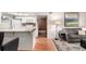Cozy living room next to kitchen with wood floors and neutral paint at 7750 W 87Th Dr # C, Arvada, CO 80005