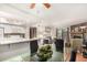 Open living area with fireplace, kitchen, and dining space for easy entertaining at 7750 W 87Th Dr # C, Arvada, CO 80005