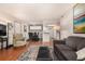 Open concept living and dining room with hardwood floors and a neutral color palette at 7750 W 87Th Dr # C, Arvada, CO 80005