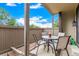 Outdoor patio with table, four chairs and a view of a blue sky with fair weather clouds at 7750 W 87Th Dr # C, Arvada, CO 80005