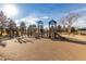 Community playground with slides, climbing structures, and plenty of space to play at 7750 W 87Th Dr # C, Arvada, CO 80005