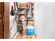 A storage space in the basement with shelving and two bicycles hanging from the ceiling at 7750 W 87Th Dr # C, Arvada, CO 80005