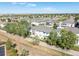 Aerial view showcasing the community and golf course at 12921 Grant W Cir # B, Thornton, CO 80241