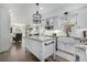 Bright kitchen featuring granite countertops, an island, and a view into the adjacent living room at 9683 Las Colinas Dr, Lone Tree, CO 80124