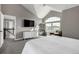 Main bedroom with a vaulted ceiling and large window that provides lots of natural light at 9683 Las Colinas Dr, Lone Tree, CO 80124