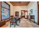 Formal dining room with large windows, hardwood trim, and period furnishings at 1650 N Pennsylvania St, Denver, CO 80203